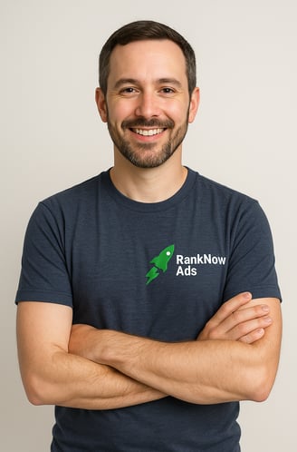 Portrait of Marvin from RankNow Ads, smiling confidently in a navy blue t-shirt with the RankNow Ads