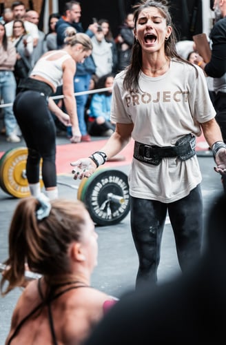 a woman in a white shirt and black pants