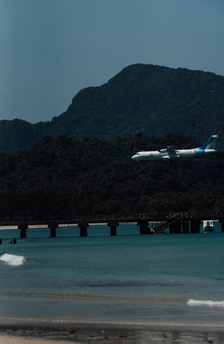 a plane taking off from a beach