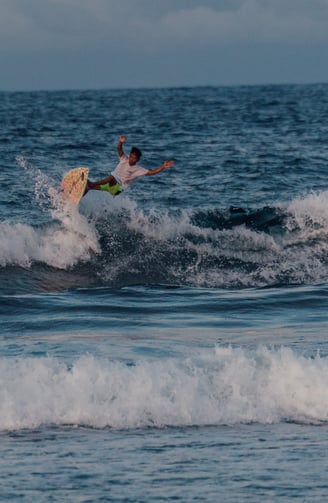 a man is surfing on a wave in the ocean