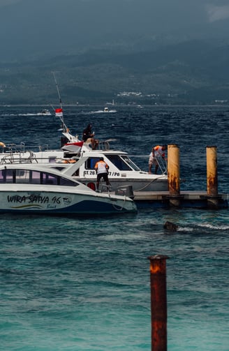 a boat with people on it in the ocean