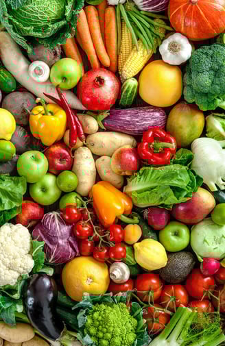 a large assortment of fruits and vegetables in a basket