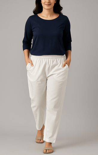 a woman in a blue top and white pants