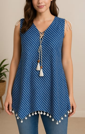 a woman in a blue top with a white top and jeans