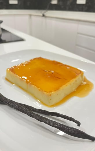 a square piece of cake with vanilla cream and vanilla cream