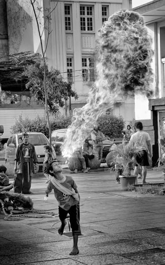 A young Indonesian street performer in Jakarta by photographer, Peter Pickering