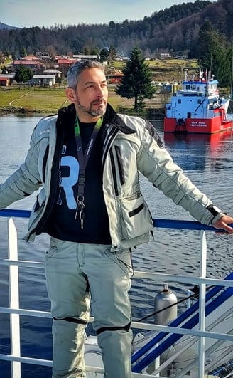 a man standing on a boat in the water