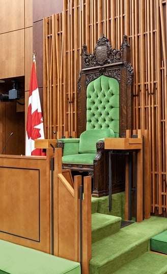 a green chair with a canadian flag