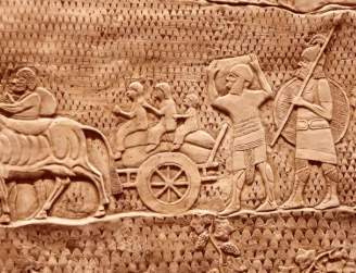 a large stone relief of a roman era relief of a chariot