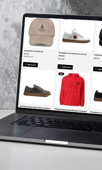 a laptop computer screen displaying YESHUA Apparel products