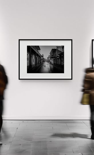 Time-lapse of visitors viewing Bourbon Street artwork in gallery setting.