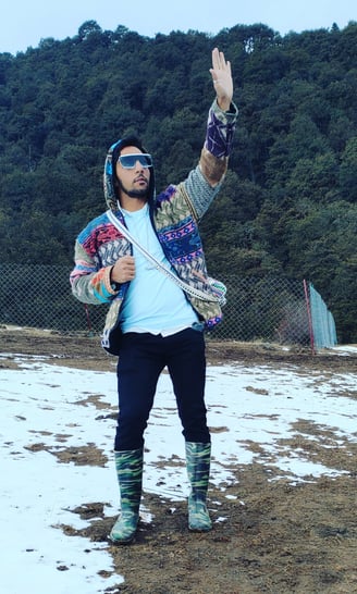 Huy Waving Hand at Ice Rock