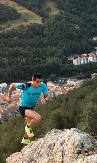 a man running on a mountain trail