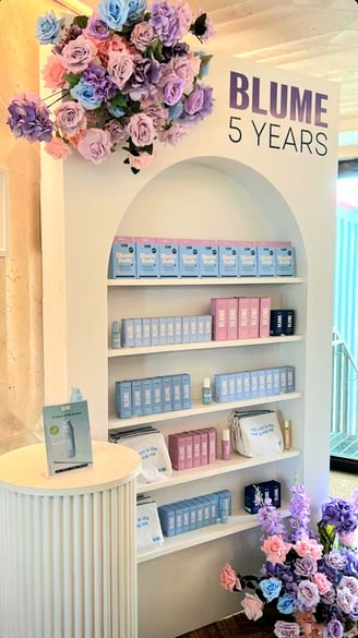 Champagne/ Treat wall of cosmetics products by Blume and flowers at Milky at the Stackt Market