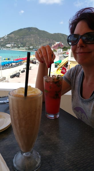 Lady enjoys a drink on St. Maarten