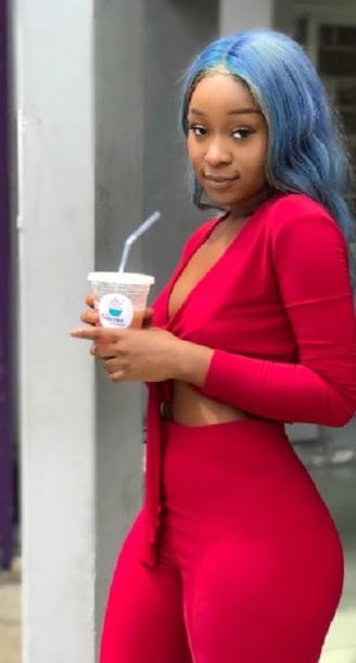 Efia Odo in a stunning red dress.