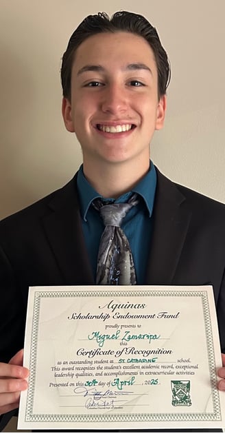 a man in a suit and tie holding a certificate