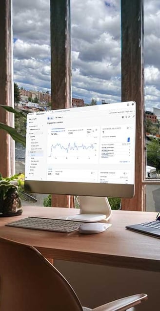 Campaign analytics on a computer screen with an office view of Spokane, WA.