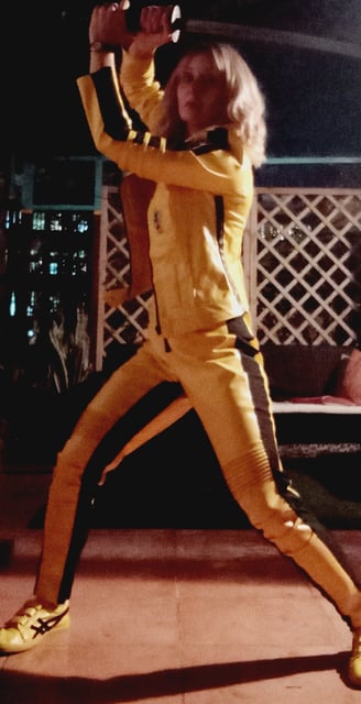 a man in a yellow jacket and yellow shoes