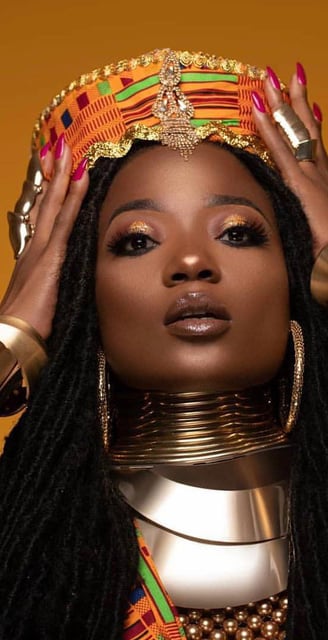 Efya Nocturnal in a kente headgear.