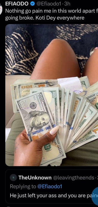Efia Odo on X replying to a user with a picture of her holding thousands of dollar notes.