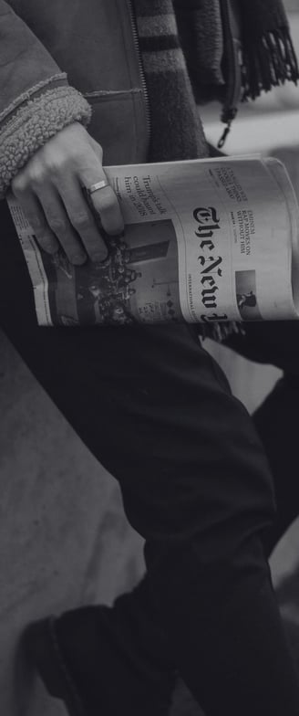 a man with high standards holding a newspaper