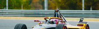 a driver racing a formua E car