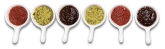 Sustainable plant-based sauces displayed in small white dishes