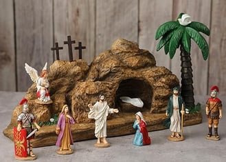 a nativity scene with figurines of jesus in a cave