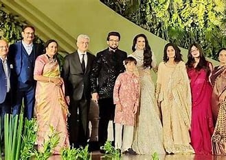 a group of people standing in front of a staircase in wedding ceremony