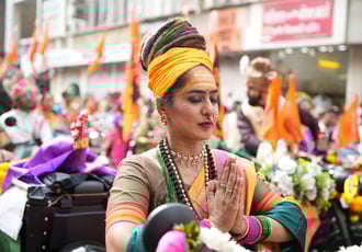woman with dreadlocks hair riding a motorbike in girgaon gudipadwa shobhayatra 2025