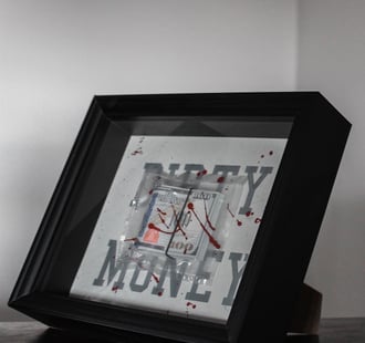 a frame with dollars and motivational quotes