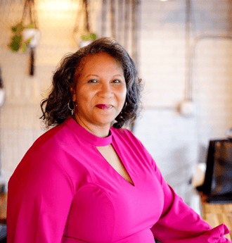 pastor dezi berry in fuschia dress
