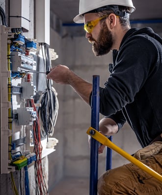 <a href="https://www.freepik.com/free-photo/male-electrician-works-switchboard-with-electrical-conne