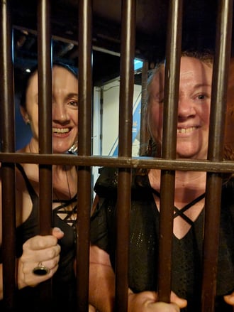 Carly and Jodi behind the bars in the strong room vault for Penny's 40th.