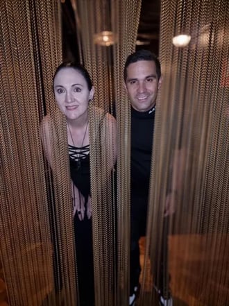 Carly and Kahn with their heads in the hanging chains at the Boom Boom Room Brisbane.