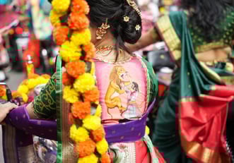 woman in maharastrian traditional outfit riding a motorbike in girgaon gudipadwa shobhayatra 2025