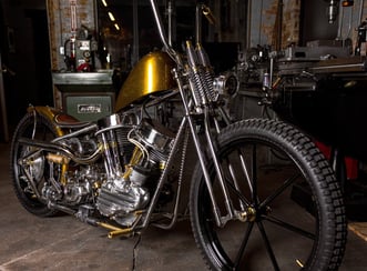 Custom hand built motorcycle parked in a building