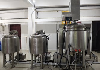 a bunch of equipment in a room to manufacture herbal oil