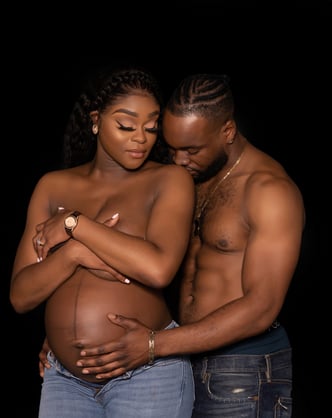 a pregnant woman and a man are standing next to each other