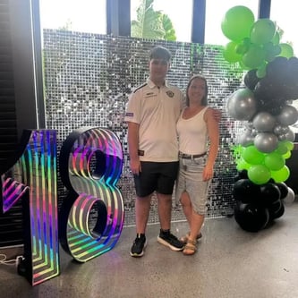 Silver shimmer wall with and 18 marquee number for Jayden's birthday in Eagleby.