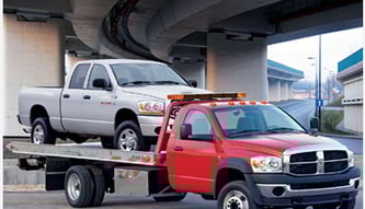 Flatbed towing junk truck