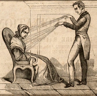 Mesmer y su magnetismo animal realizando una sesión de hipnosis