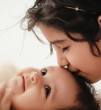 Adorable baby smiling during a professional photoshoot at Vidaychandra Photostudio