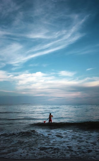man surfing on the sea