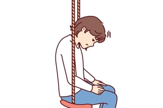 Grieving girl on a swing