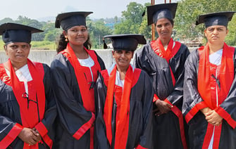 a group of women in graduation gowns 