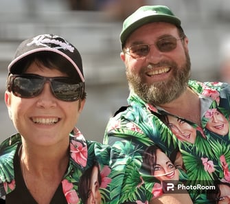 Chrissie and Danny portrait shot in Hawaiian shirts.