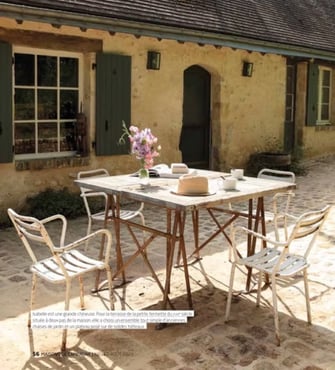 a table with a table set up outside, French countryside, normandy, cottage