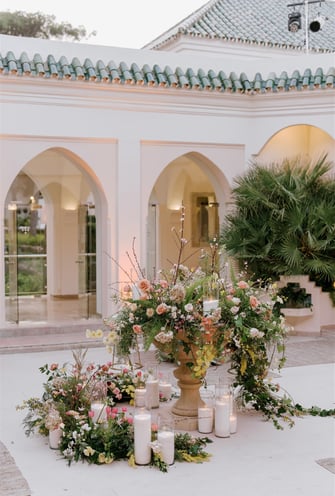 Outdoor dining area at Villa El Rincon in Marbella, with beautiful decorations for a Mediterranean destination wedding.